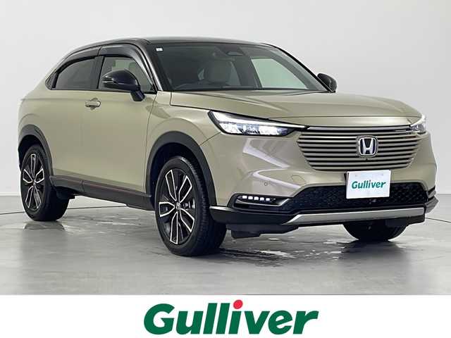 ホンダ ヴェゼル ハイブリッド e:HEV PLaY 岐阜県 2021(令3)年 2.5万km サンドカーキパール 純正9インチディスプレイオーディオ/Bluetooth/フルセグＴＶ/AppleCarPlay/AndroidAuto/パノラマルーフ/ワイヤレス充電器/ブラインドスポットインフォメーション/アダプティブクルーズコントロール/車線維持支援システム/パーキングセンサー/パワーテールゲート/シートーヒーター/ドライブレコーダー/ETC/ヒルディセントコントロール/パドルシフト/ステアリングリモコン/ヘッドライトレベライザー/オートLEDヘッドライト/純正フロアマット/純正18インチアルミホイール/純正ドアバイザー