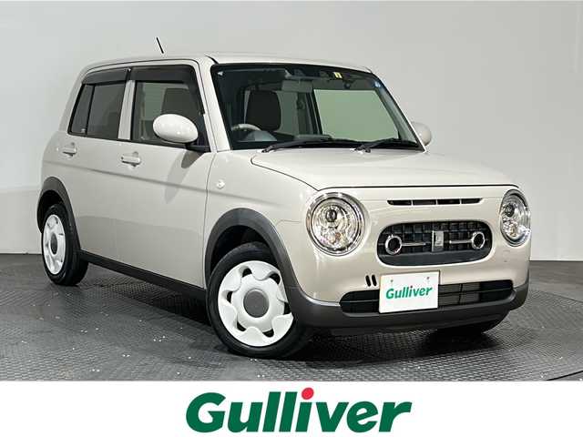 スズキ ラパン ＬＣ L 愛媛県 2022(令4)年 1.3万km フォーンベージュM ・ナビ（ワンセグＴＶ・ＢＴ・ＳＤ・ＣＤ・ＤＶＤ・ＦＭ・ＡＭ）/・前後ドラレコ　/・Ｄ席シートヒーター　/・衝突軽減ブレーキ　/・レーンキープアシスト　/・ＵＳＢ充電