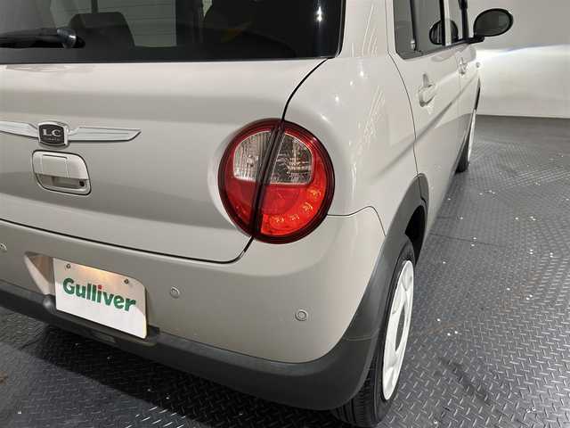 スズキ ラパン ＬＣ L 愛媛県 2022(令4)年 1.3万km フォーンベージュM ・ナビ（ワンセグＴＶ・ＢＴ・ＳＤ・ＣＤ・ＤＶＤ・ＦＭ・ＡＭ）/・前後ドラレコ　/・Ｄ席シートヒーター　/・衝突軽減ブレーキ　/・レーンキープアシスト　/・ＵＳＢ充電