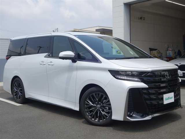 トヨタ ヴェルファイア ハイブリット Z プレミア 静岡県 2023(令5)年 0.3万km プラチナホワイトパールマイカ ワンオーナー／禁煙車/走行距離2232キロ/車検R8年8月29日/純正オプション/　・サンセットブラウンプレミアムナッパ革シート/　・13.2インチフリップダウンモニター/　・電子インナーミラー型ドライブレコーダー/　（前後方カメラ）/　・ユニバーサルステップ/トヨタセーフティセンス/BSM/トヨタチームメイト/　・アドバンストパーク/　・パーキングサポートブレーキ/　・アドバンストドライブ/　・リモート機能/左右独立ムーンルーフ/14インチディスプレイオーディオ/　ナビ／USB/HDMI/フルセグTV/　(TVキット付)／AppleCarPlay／/　Android audio/ETC2.0/おくだけ充電/ヘッドアップディスプレイ/快適温熱シート/前席パワーシート（運転席メモリー付）/2列目エグゼクティブパワーシート/　・パワーリクライニング/　・パワーオットマン/　・快適温熱シート/　・サイドテーブル/　・USB端子/5面スモーク施工/両側パワースライドドア/パワーバックドア/3眼LEDヘッドライト/プッシュスタート／スマートキー/純正フロアマット/保証書