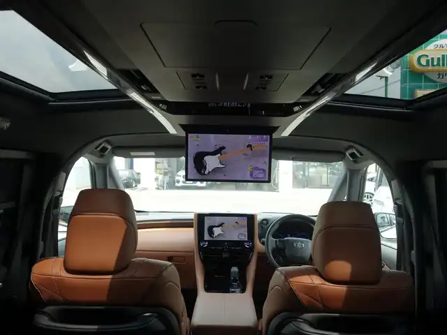 トヨタ ヴェルファイア ハイブリット Z プレミア 静岡県 2023(令5)年 0.3万km プラチナホワイトパールマイカ ワンオーナー／禁煙車/走行距離2232キロ/車検R8年8月29日/純正オプション/　・サンセットブラウンプレミアムナッパ革シート/　・13.2インチフリップダウンモニター/　・電子インナーミラー型ドライブレコーダー/　（前後方カメラ）/　・ユニバーサルステップ/トヨタセーフティセンス/BSM/トヨタチームメイト/　・アドバンストパーク/　・パーキングサポートブレーキ/　・アドバンストドライブ/　・リモート機能/左右独立ムーンルーフ/14インチディスプレイオーディオ/　ナビ／USB/HDMI/フルセグTV/　(TVキット付)／AppleCarPlay／/　Android audio/ETC2.0/おくだけ充電/ヘッドアップディスプレイ/快適温熱シート/前席パワーシート（運転席メモリー付）/2列目エグゼクティブパワーシート/　・パワーリクライニング/　・パワーオットマン/　・快適温熱シート/　・サイドテーブル/　・USB端子/5面スモーク施工/両側パワースライドドア/パワーバックドア/3眼LEDヘッドライト/プッシュスタート／スマートキー/純正フロアマット/保証書