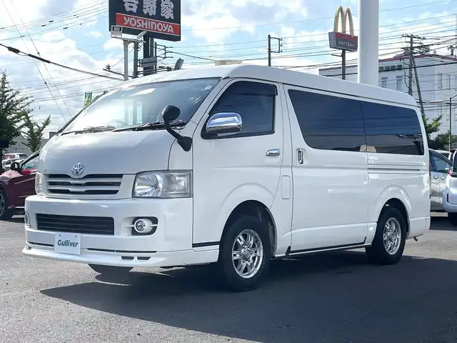 トヨタ ハイエース GL 道央・札幌 2010(平22)年 11.7万km ホワイト 4WD/キャンピング仕様/10人乗り/社外ナビ/フルセグTV/CD/DVD/MS/AM/FM/バックカメラ/パワースライドドア/リアテーブル/シートベッド/インバーター/サブバッテリー/FFヒーター/冷蔵庫/ドラレコ（前方タイプ）/ETC/社外15インチAW/ヒッチメンバー/室内フルカーテン/リモコンキー/スペアキー/社外エンジンスターター/保証書/取扱説明書