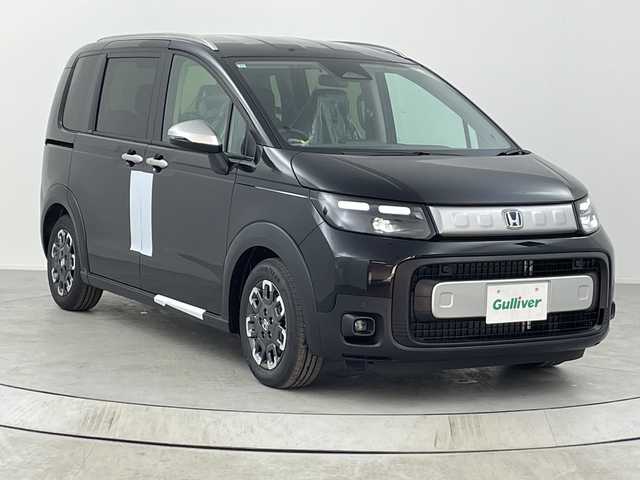 ホンダ フリード ハイブリット e:HEV クロスター 熊本県 2025(令7)年 0.1千km クリスタルブラックパール 未使用車　/ホンダコネクト９型ナビ（ＴＶ／ＢＴ）　/ホンダセンシング　/ＢＳＭ　/レーダークルーズコントロール/シートヒーター　/両側電動パワスラ/バックカメラ　/コーナーセンサー　/純正LEDヘッドライト/フォグランプ/純正アルミホイール15インチ/サーキュレーター　/スマートキー　/スペアキー　/ＵＳＢ