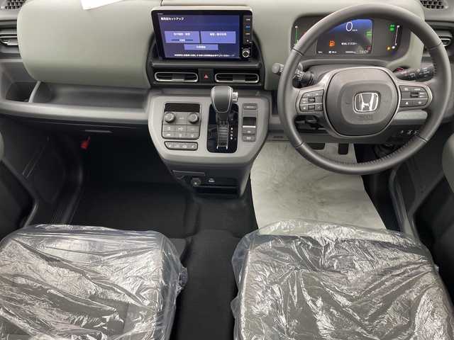 ホンダ フリード ハイブリット e:HEV クロスター 熊本県 2025(令7)年 0.1千km クリスタルブラックパール 未使用車　/ホンダコネクト９型ナビ（ＴＶ／ＢＴ）　/ホンダセンシング　/ＢＳＭ　/レーダークルーズコントロール/シートヒーター　/両側電動パワスラ/バックカメラ　/コーナーセンサー　/純正LEDヘッドライト/フォグランプ/純正アルミホイール15インチ/サーキュレーター　/スマートキー　/スペアキー　/ＵＳＢ
