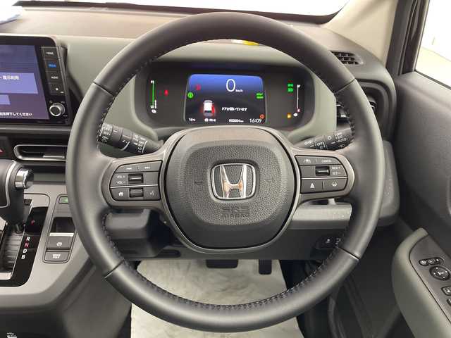 ホンダ フリード ハイブリット e:HEV クロスター 熊本県 2025(令7)年 0.1千km クリスタルブラックパール 未使用車　/ホンダコネクト９型ナビ（ＴＶ／ＢＴ）　/ホンダセンシング　/ＢＳＭ　/レーダークルーズコントロール/シートヒーター　/両側電動パワスラ/バックカメラ　/コーナーセンサー　/純正LEDヘッドライト/フォグランプ/純正アルミホイール15インチ/サーキュレーター　/スマートキー　/スペアキー　/ＵＳＢ