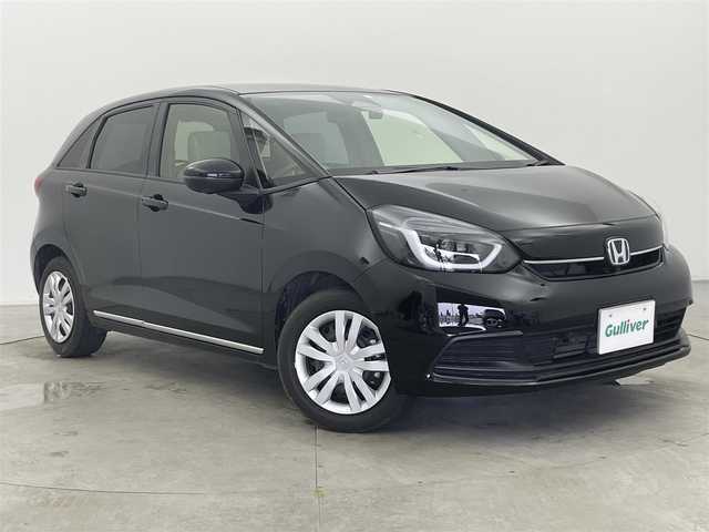 ホンダ フィット e:HEVホーム 富山県 2023(令5)年 2.1万km クリスタルブラックパール 純正ナビ（AM/FM/BT/USB/フルセグ）/全方位カメラ/ドライブレコーダー/ETC/ブラインドスポットモニター/OPグレー半革シート/シートヒーター/衝突被害軽減システム/レーダークルーズコントロール/レーンキープアシスト/コーナーセンサー/横滑り防止装置/アイドリングストップ/オートLEDライト/フォグライト/純正フロアマット/オートホールド付電子パーキング/革巻きステアリング/ステアリングスイッチ/スマートキー