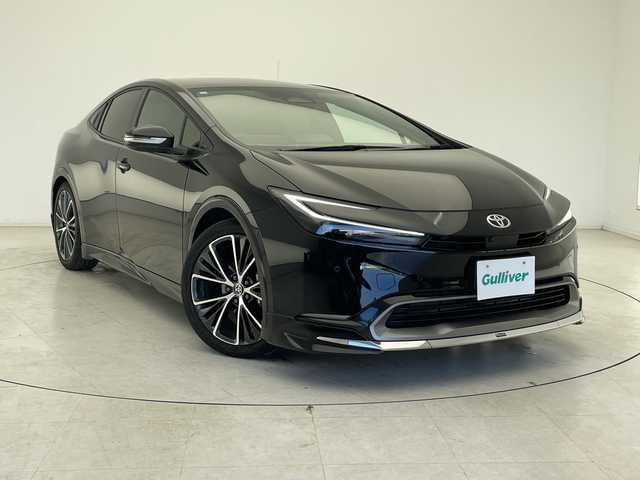 トヨタ プリウス Z 千葉県 2023(令5)年 1.8万km アティチュードブラックマイカ モデリスタエアロ（F/S/R）/トヨタセーフティセンス/プリクラッシュセーフティ/レーントレーシングアシスト/レーンディパーチャーアラート/ロードサインアシスト/レーダークルーズコントロール/オートマチックハイビーム/先行車発進アラーム/プロアクティブドライビングアシスト/レーンチェンジアシスト/緊急時操舵支援/フロントクロストラフィックアラート/ブラインドスポットモニター/リアクロストラフィックアラート/12.3型純正ナビ/　Bluetooth/AppleCarplay/AndroidAuto/フルセグTV/パノラミックビューモニター/ビルトインETC2.0/パノラマルーフ/パワーバックドア/レザーシート/前席シートヒーター/前席エアーシート/運転席パワーシート/ステアリングヒーター/ワイヤレス充電/AC100V電源/オートライト/LEDヘッドライト