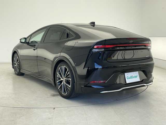 トヨタ プリウス Z 千葉県 2023(令5)年 1.8万km アティチュードブラックマイカ モデリスタエアロ（F/S/R）/トヨタセーフティセンス/プリクラッシュセーフティ/レーントレーシングアシスト/レーンディパーチャーアラート/ロードサインアシスト/レーダークルーズコントロール/オートマチックハイビーム/先行車発進アラーム/プロアクティブドライビングアシスト/レーンチェンジアシスト/緊急時操舵支援/フロントクロストラフィックアラート/ブラインドスポットモニター/リアクロストラフィックアラート/12.3型純正ナビ/　Bluetooth/AppleCarplay/AndroidAuto/フルセグTV/パノラミックビューモニター/ビルトインETC2.0/パノラマルーフ/パワーバックドア/レザーシート/前席シートヒーター/前席エアーシート/運転席パワーシート/ステアリングヒーター/ワイヤレス充電/AC100V電源/オートライト/LEDヘッドライト