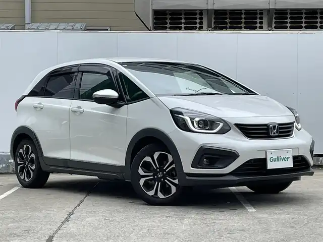 ホンダ フィット e:HEVクロスター 青森県 2022(令4)年 4.2万km プラチナホワイトパール ●ワンオーナー/●純正ＳＤナビフルセグ/（ＶＸＭ－２１５ＶＦＥＩ）/●バックモニター/●ＬＥＤヘッドライト/●純正エンスタ/●純正１６ＡＷ夏/●純正１６ＡＷ冬/●Ｈｏｎｄａ　ＳＥＮＳＩＮＧ/●カーテンエアバック/●スマートキー/●スペアキー/●新車時保証書/●取扱い説明書