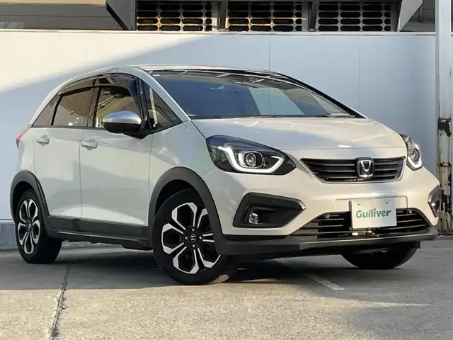 ホンダ フィット e:HEVクロスター 青森県 2022(令4)年 4.2万km プラチナホワイトパール ●ワンオーナー/●純正ＳＤナビフルセグ/（ＶＸＭ－２１５ＶＦＥＩ）/●バックモニター/●ＬＥＤヘッドライト/●純正エンスタ/●純正１６ＡＷ夏/●純正１６ＡＷ冬/●Ｈｏｎｄａ　ＳＥＮＳＩＮＧ/●カーテンエアバック/●スマートキー/●スペアキー/●新車時保証書/●取扱い説明書