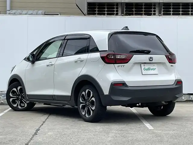 ホンダ フィット e:HEVクロスター 青森県 2022(令4)年 4.2万km プラチナホワイトパール ●ワンオーナー/●純正ＳＤナビフルセグ/（ＶＸＭ－２１５ＶＦＥＩ）/●バックモニター/●ＬＥＤヘッドライト/●純正エンスタ/●純正１６ＡＷ夏/●純正１６ＡＷ冬/●Ｈｏｎｄａ　ＳＥＮＳＩＮＧ/●カーテンエアバック/●スマートキー/●スペアキー/●新車時保証書/●取扱い説明書
