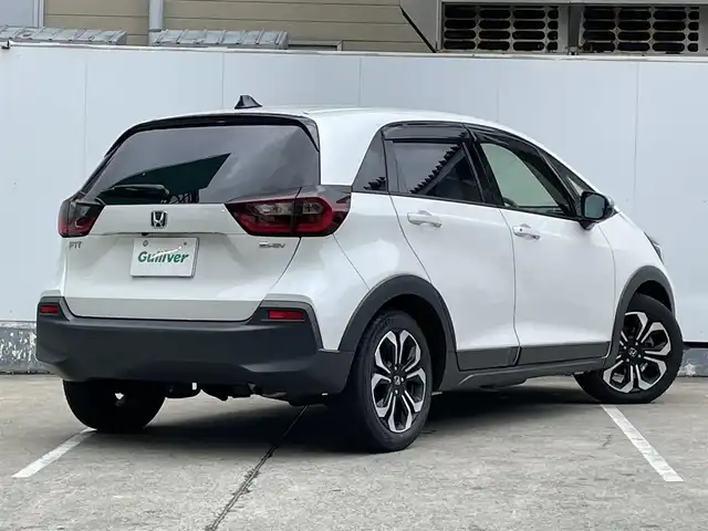 ホンダ フィット e:HEVクロスター 青森県 2022(令4)年 4.2万km プラチナホワイトパール ●ワンオーナー/●純正ＳＤナビフルセグ/（ＶＸＭ－２１５ＶＦＥＩ）/●バックモニター/●ＬＥＤヘッドライト/●純正エンスタ/●純正１６ＡＷ夏/●純正１６ＡＷ冬/●Ｈｏｎｄａ　ＳＥＮＳＩＮＧ/●カーテンエアバック/●スマートキー/●スペアキー/●新車時保証書/●取扱い説明書