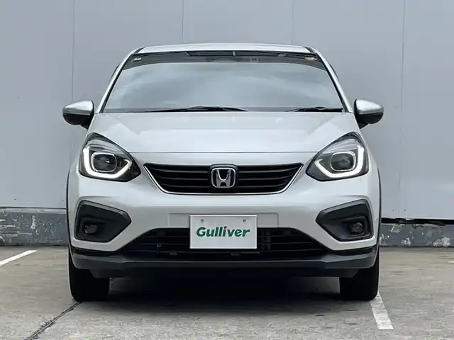 ホンダ フィット e:HEVクロスター 青森県 2022(令4)年 4.2万km プラチナホワイトパール ●ワンオーナー/●純正ＳＤナビフルセグ/（ＶＸＭ－２１５ＶＦＥＩ）/●バックモニター/●ＬＥＤヘッドライト/●純正エンスタ/●純正１６ＡＷ夏/●純正１６ＡＷ冬/●Ｈｏｎｄａ　ＳＥＮＳＩＮＧ/●カーテンエアバック/●スマートキー/●スペアキー/●新車時保証書/●取扱い説明書