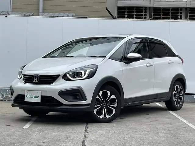 ホンダ フィット e:HEVクロスター 青森県 2022(令4)年 4.2万km プラチナホワイトパール ●ワンオーナー/●純正ＳＤナビフルセグ/（ＶＸＭ－２１５ＶＦＥＩ）/●バックモニター/●ＬＥＤヘッドライト/●純正エンスタ/●純正１６ＡＷ夏/●純正１６ＡＷ冬/●Ｈｏｎｄａ　ＳＥＮＳＩＮＧ/●カーテンエアバック/●スマートキー/●スペアキー/●新車時保証書/●取扱い説明書
