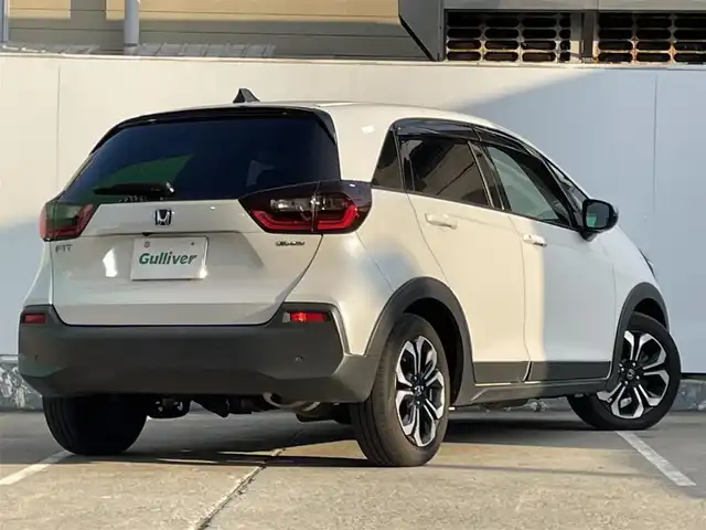 ホンダ フィット e:HEVクロスター 青森県 2022(令4)年 4.2万km プラチナホワイトパール ●ワンオーナー/●純正ＳＤナビフルセグ/（ＶＸＭ－２１５ＶＦＥＩ）/●バックモニター/●ＬＥＤヘッドライト/●純正エンスタ/●純正１６ＡＷ夏/●純正１６ＡＷ冬/●Ｈｏｎｄａ　ＳＥＮＳＩＮＧ/●カーテンエアバック/●スマートキー/●スペアキー/●新車時保証書/●取扱い説明書