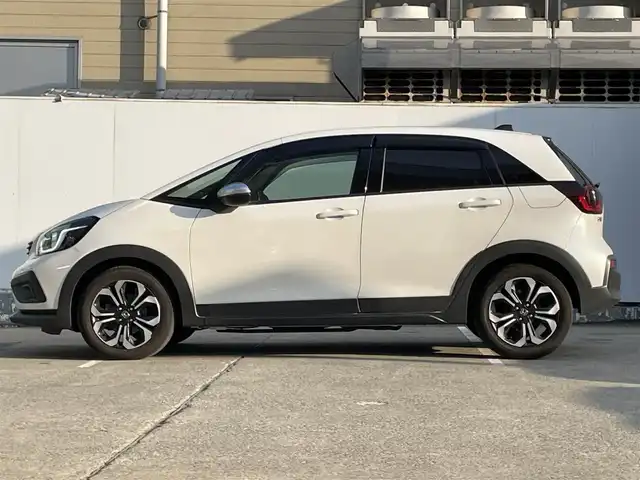 ホンダ フィット e:HEVクロスター 青森県 2022(令4)年 4.2万km プラチナホワイトパール ●ワンオーナー/●純正ＳＤナビフルセグ/（ＶＸＭ－２１５ＶＦＥＩ）/●バックモニター/●ＬＥＤヘッドライト/●純正エンスタ/●純正１６ＡＷ夏/●純正１６ＡＷ冬/●Ｈｏｎｄａ　ＳＥＮＳＩＮＧ/●カーテンエアバック/●スマートキー/●スペアキー/●新車時保証書/●取扱い説明書