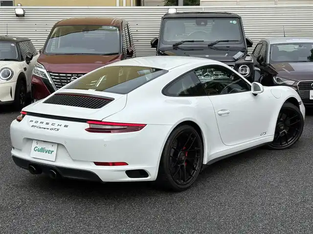 ポルシェ ９１１ カレラ GTS 東京都 2019(令1)年 2万km ピュアホワイト スポーツクロノパッケージ（ステアリングスイッチ付）/PASM（ポルシェアクティブ・サスペンション・マネジメント）/スポーツエキゾースト/保証書・取説・キーレスキー×２/R2.3.4.5.6年ディーラー記録簿/アルカンターラーステアリング・パドルシフト/アイドリングストップ/クルーズコントロール/電動リアスポイラー/GTS専用黒ハーフレザーシート/前席一部パワーシート・シートヒーター/純正HDDナビ/DVD/CD/SD/BT/USB/バックカメラ・バックセンサー/ビルトインETC（DSRC）/外前後ドラレコ/外レーダー（Z291csd）/純正２０インチブラックアルミ（センターロック式）/ポルシェダイナミックHIDライト（バイキセノン）・オートライト・リアフォグ・ヘッドライトクリーナー/電動格納ミラー/AUHOHOLD
