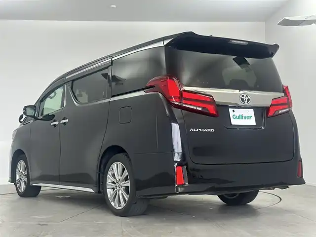 トヨタ アルファード S タイプゴールドⅡ 愛知県 2021(令3)年 5.7万km ブラック ・純正10インチナビ/・Bluetooth/・バックカメラ/・フルセグTV/・12.1インチフリップダウンモニター/・トヨタセーフティセンス/・衝突被害軽減システム/・クルーズコントロール/・コーナーセンサー/・レーンキープアシスト/・ブラインドスポットモニター/・オートマチックハイビーム/・オートライト/・LEDヘッドライト/・LEDフォグランプ/・三眼ヘッドライト/・両側パワースライドドア/・デジタルインナーミラー/・電動リアゲート/・ドライブレコーダー/・ETC2.0/・純正AW/・プッシュスタート/・スマートキー