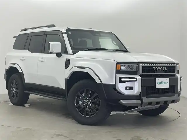 トヨタ ランドクルーザー ２５０ VX 富山県 2024(令6)年 0.3万km プラチナホワイトパールマイカ フルタイム4WD/12.3インチ純正DA（USB/BT/HDMI/Miracast）/フルセグTV/アラウンドビューモニター/サンルーフ/モデリスタフロントバンパーガード/モデリスタフロントアンダーカバー/モデリスタリヤバンパーガーニッシュ/モデリスタシグネチャーイルミブレード/モデリスタオーバーフェンダー/モデリスタフェンダーガーニッシュ/モデリスタリヤバンパーステップガード/モデリスタリヤスポイラー/寒冷地仕様/AUTHORセキュリティ/トヨタチームメイト/プリクラッシュセーフティ/レーダークルーズコントロール/レーンキープアシスト/安心降車アシスト/ロードサインアシスト/オートマチックハイビーム/LEDヘッドライト/コーナーセンサー前後/レザーシート/前席温熱シート＋シートベンチレーション/電動リアゲート/ビルトインETC2.0/デジタルインナーミラー/ヘッドライトウォッシャー/純正１８インチAW/社外フロアマット/スマートキー/プッシュスタート/取扱説明書/保証書