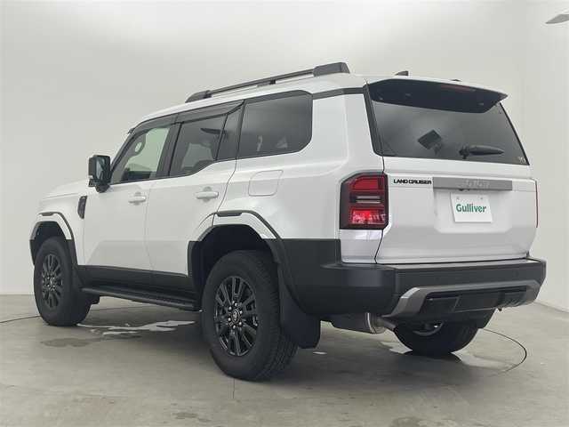 トヨタ ランドクルーザー ２５０ VX 富山県 2024(令6)年 0.3万km プラチナホワイトパールマイカ フルタイム4WD/12.3インチ純正DA（USB/BT/HDMI/Miracast）/フルセグTV/アラウンドビューモニター/サンルーフ/モデリスタフロントバンパーガード/モデリスタフロントアンダーカバー/モデリスタリヤバンパーガーニッシュ/モデリスタシグネチャーイルミブレード/モデリスタオーバーフェンダー/モデリスタフェンダーガーニッシュ/モデリスタリヤバンパーステップガード/モデリスタリヤスポイラー/寒冷地仕様/AUTHORセキュリティ/トヨタチームメイト/プリクラッシュセーフティ/レーダークルーズコントロール/レーンキープアシスト/安心降車アシスト/ロードサインアシスト/オートマチックハイビーム/LEDヘッドライト/コーナーセンサー前後/レザーシート/前席温熱シート＋シートベンチレーション/電動リアゲート/ビルトインETC2.0/デジタルインナーミラー/ヘッドライトウォッシャー/純正１８インチAW/社外フロアマット/スマートキー/プッシュスタート/取扱説明書/保証書