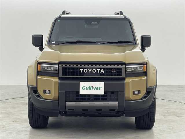 トヨタ ランドクルーザー ２５０ ZX 福岡県 2025(令7)年 0.4万km ベージュⅡ ワンオーナー　/ムーンルーフ/メーカーＤＡナビ/フルセグTV　/全方位カメラ　/ＪＢＬサウンド　/デジタルインナーミラー　/ワイヤレス充電　/ビルトインＥＴＣ２．０　/トヨタセーフティセンス　/レーダークルーズコントロール　/コーナーセンサー　/衝突軽減ブレーキ　/レーダーキープ　/ブラインドスポットモニター　/アクセル踏み間違い防止　/ヒルディセントコントロール　/ヘッドアップディスプレイ　/パドルシフト　/パワーシート　/シートヒーター/ベンチレーション　/パワーバックドア　/ルーフレール　/純正２０インチアルミホイール　/ＬＥＤヘッドライト