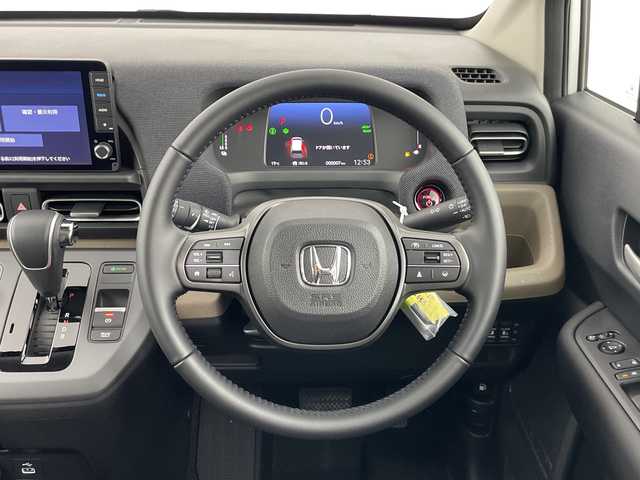 ホンダ フリード ハイブリット e:HEV AIR EX 愛知県 2025(令7)年 0.1千km プラチナホワイトパール 登録済未使用車/6人乗り/純正9インチナビ/（AM/FM/Bluetooth/フルセグTV/USB)/バックカメラ/ホンダセンシング/・衝突軽減ブレーキ/・レーンキープアシスト/・アダプティブクルーズコントロール/・先行車発進お知らせ機能/・オートマチックハイビーム/・パーキングセンサーシステム/・ブラインドスポットモニター/ハーフレザーシート/シートヒーター/両側パワースライドドア/アイドリングストップ/純正15インチアルミホイール/スマートキー/スペアキー1本/プッシュスタート/LEDヘッドライト/横滑り防止装置