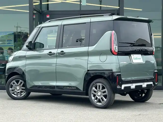 三菱 デリカミニ T プレミアム 東京都 2025(令7)年 0.1万km未満 緑Ｍ 届出済未使用車/純正ディスプレイオーディオ/全方位カメラ/三菱e-Assist/・衝突被害軽減ブレーキシステム/・踏み間違い衝突防止アシスト/・オートマチックハイビーム/・標識認識システム/・先行車発進通知/・車線逸脱警報システム/・車線逸脱防止支援機能/・ふらつき警報/・前方衝突予測警報/マイパイロット/・レーダークルーズコントロール/・車線維持支援機能/コーナーセンサー/両側パワースライドドア/シートヒーター/ルーフレール/デジタルインナーミラー/ステアリングヒーター/LEDヘッドライト/パドルシフト/純正アルミホイール