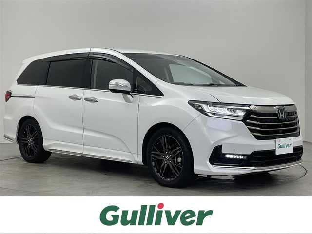 ホンダ オデッセイ ハイブリッド e:HEVアブソルート EX 埼玉県 2021(令3)年 6.1万km プラチナホワイトパール 純正９インチナビ　マルチビューモニター　デジタルミラー　パワーバックドア　アダプティブクルーズコントロール　ＢＳＭ　両側パワースライドドア　シートヒーター　ホンダセンシング　前後ドラレコ　ＬＥＤライト