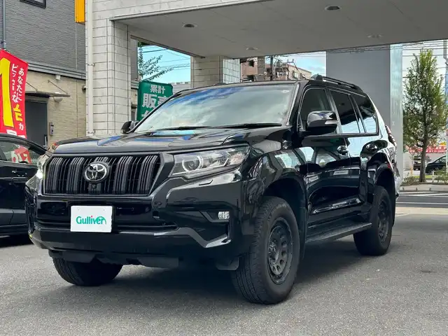 トヨタ ランドクルーザー プラド TX 愛知県 2024(令6)年 1.4万km ブラック ムーンルーフ〈MOP〉/ブラックルーフレール〈MOP〉/クリアランスソナー〈MOP〉/純正9型ディスプレイオーディオ/・Tコネクトナビ／Bluetooth／Miracast/パノラミックビューカメラ/LEDヘッドライト／デイライト／フォグランプ/ヒルスタートアシストコントロール/トラクションコントロール/サイドステップ/リアスポイラー/社外17インチAW〈純正AW積込〉/TOYOTA SAFETY SENSE/・プリクラッシュセーフティ/・レーンディパーチャーアラート/・オートマチックハイビーム/・レーダークルーズコントロール/・ロードサインアシスト/・先行車発進告知/パーキングサポートブレーキ/スマートキー＆プッシュスタート