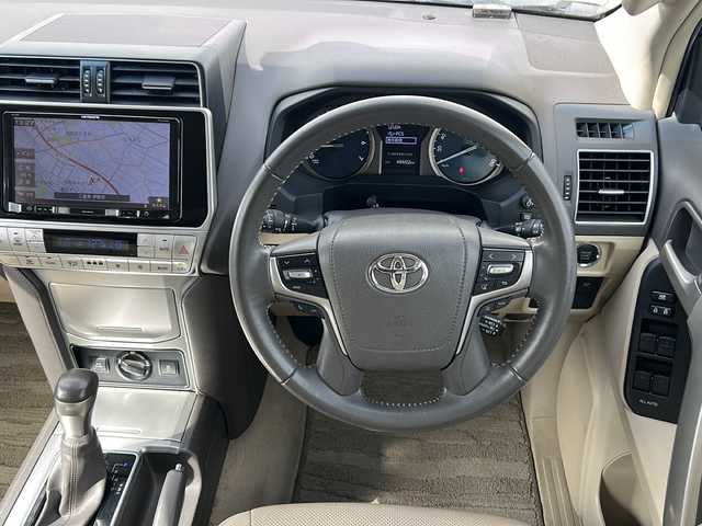 トヨタ ランドクルーザー プラド TX Lパッケージ 三重県 2019(令1)年 4.9万km ホワイトパールクリスタルシャイン 社外９型ナビ　/サンルーフ　/ＡＬＰＩＮＥ後席モニター　/バックカメラ　/ＥＴＣ　/電動格納サードシート　/前席エアーシート /前後コーナーセンサー /レーダークルーズコントロール /レーンキープアシスト/衝突軽減ブレーキ/革巻きステアリング/ステアリングスイッチ/純正フロアマット/LEDヘッドライト/オートハイビーム /オートライト/電動格納ミラー/禁煙車