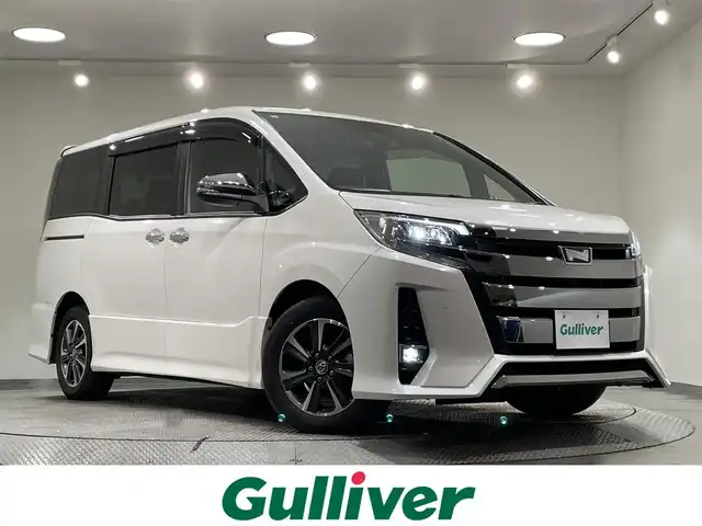トヨタ ノア Si ダブルバイビーⅢ 愛知県 2021(令3)年 6.1万km ホワイトパールクリスタルシャイン 純正１０インチナビ/純正12インチフリップダウンモニター/両側パワースライドドア/プリクラッシュセーフティ/レーンディパーチャーアラート/クリアランスソナー/先行車発進告知/クルーズコントロール/ハーフレザーシート/バックカメラ/前後ドライブレコーダー/ビルトインＥＴＣ/ＵＳＢ＆HDMI入力端子/アクセサリーソケット/ＬＥＤヘッドライト/オートハイビーム/アイドリングストップ/ISOFIX/純正フロアマット/純正16インチアルミホイール
