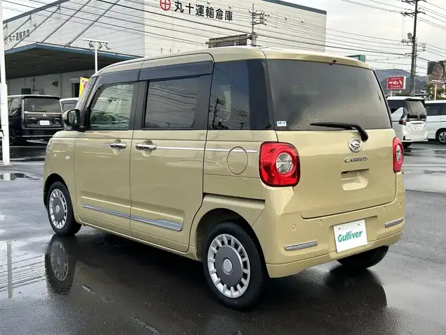 ダイハツ ムーヴ キャンバス セオリー G 岡山県 2022(令4)年 1.7万km サンドベージュメタリック 登録時走行距離16795km/社外ナビ/フルセグTV(AM/FM/CD/DVD/Bluetooth)/パノラマモニター/両側パワースライドドア/衝突回避支援ブレーキ機能/横滑り防止装置/コーナーセンサー/アイドリングストップ/電動パーキングブレーキ/オートブレーキホールド機能/オートライト/D/N席シートヒーター/プッシュスタート/スマートキー×2/純正フロアマット