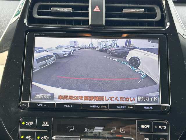 トヨタ プリウス Sセーフティプラス 愛媛県 2016(平28)年 3.5万km スティールブロンドM 禁煙車/登録時走行距離：34709km/ディーラーオプション純正9インチナビ/CD/DVD/フルセグTV/Bluetooth/バックカメラ/ビルトインETC2.0/ヘッドアップディスプレイ/衝突被害軽減システム/クリアランスソナー/横滑り防止装置/レーンキープアシスト/パーキングアシスト/LEDヘッドライト/フォグランプ/オートライト/オートマチックハイビーム/エンジンスタートボタン/スマートキー/スペアキー/純正フロアマット/純正15インチアルミホイール
