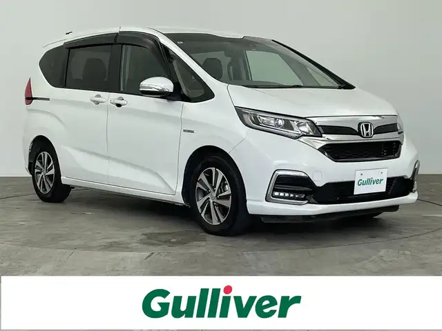 ホンダ フリード ハイブリット G ホンダセンシング 大分県 2022(令4)年 4.9万km プラチナホワイトパール 純正gathersナビ【VXM-227VFMi】/バックカメラ/両側パワースライドドア/LEDヘッドライト/センターテーブル/オートリトラミラー/純正後席モニター/フロントワイパーデザイサースイッチ/シートバックテーブル/純正フロアマット/ドアバイザー/レーダークルーズコントロール/本革巻きステアリング/スマートキー/ビルトインETC/リアコーナーセンサー