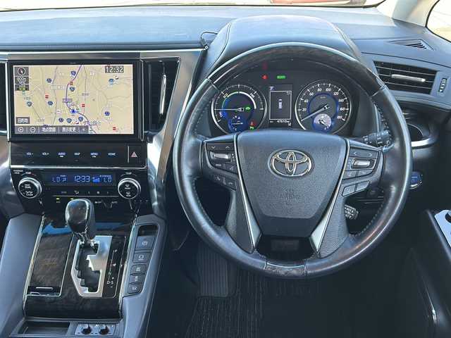 トヨタ ヴェルファイア ハイブリット ZR 山形県 2019(令1)年 4.8万km ブラック 禁煙車/4WD/トヨタセーフティーセンス/レーダークルーズコントロール/両側パワースライドドア/前後コーナーセンサー/前後ドライブレコーダー/バックカメラ/純正ナビ/（Bluetooth/CD/DVD/フルセグ)/フリップダウンモニター/電動リアゲート/LEDオートライト/フォグランプ/レザーシート/前席パワーシート/メモリーシート/前席シートヒーター/前席エアシート/オットマン/ステアリングスイッチ/電動パーキングブレーキ/オートブレーキホールド/ビルトインETC2.0/純正AW/純正フロアマット/スマートキー×2/電動格納ウィンカーミラー/ドアバイザー