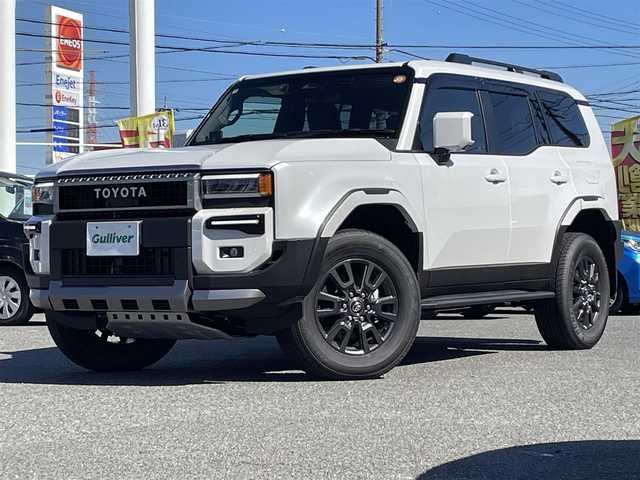 トヨタ ランドクルーザー ２５０ VX 愛知県 2024(令6)年 0.1千km プラチナホワイトパールマイカ /禁煙車//ワンオーナー//サンルーフ//モデリスタパッケージ//モデリスタオーバーフェンダー//モデリスタリアスポイラー//モデリスタリヤバンパーステップガード//モデリスタシグネチャーイルミブレード//モデリスタLEDスマートフットライト//12.3インチディスプレイオーディオ//フルセグTV/BT/USB/Miracast//パノラミックビューモニター//黒革シート//エアシート//シートヒーター//パワーシート//ETC2.0//デジタルインナーミラー//パワーバックドア//ルーフレール//サイドステップ//MTモード付AT//純正ドライブレコーダー//PCS/LDA/BSM/PDA/RSA/ACC/RCTA/RCD/クリアランスソナー/安心降車アシスト/後方車両接近検知//オートリトラウィンカーミラー//LEDオートライト//オートハイビーム//ヘッドライトウォッシャー//純正フロアマット//純正ドアバイザー//純正トノカバー//純正ラゲージソフトトレイ//プロジェクションカーテンイルミ//ドアエッジプロテクター//革巻きステアリング//ステアリングスイッチ//ステアリングヒーター//エアコンドリンクホルダー//GPSレーダー探知機//スペアスマートキー//新車時保証書//取扱説明書