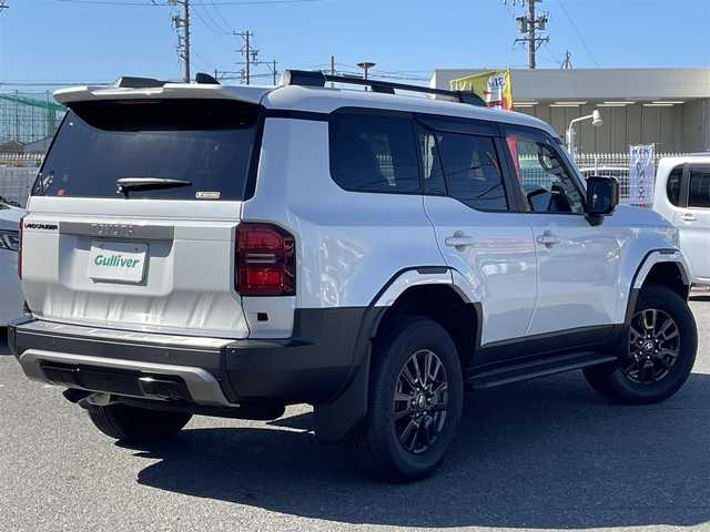 トヨタ ランドクルーザー ２５０ VX 愛知県 2024(令6)年 0.1千km プラチナホワイトパールマイカ /禁煙車//ワンオーナー//サンルーフ//モデリスタパッケージ//モデリスタオーバーフェンダー//モデリスタリアスポイラー//モデリスタリヤバンパーステップガード//モデリスタシグネチャーイルミブレード//モデリスタLEDスマートフットライト//12.3インチディスプレイオーディオ//フルセグTV/BT/USB/Miracast//パノラミックビューモニター//黒革シート//エアシート//シートヒーター//パワーシート//ETC2.0//デジタルインナーミラー//パワーバックドア//ルーフレール//サイドステップ//MTモード付AT//純正ドライブレコーダー//PCS/LDA/BSM/PDA/RSA/ACC/RCTA/RCD/クリアランスソナー/安心降車アシスト/後方車両接近検知//オートリトラウィンカーミラー//LEDオートライト//オートハイビーム//ヘッドライトウォッシャー//純正フロアマット//純正ドアバイザー//純正トノカバー//純正ラゲージソフトトレイ//プロジェクションカーテンイルミ//ドアエッジプロテクター//革巻きステアリング//ステアリングスイッチ//ステアリングヒーター//エアコンドリンクホルダー//GPSレーダー探知機//スペアスマートキー//新車時保証書//取扱説明書