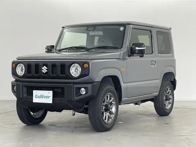 スズキ ジムニー XC 群馬県 2024(令6)年 0.1万km未満 ミディアムグレー 届出済未使用車(登録時走行距離:8km)/社外７インチナビ/シートヒーター/スズキセーフティサポート/・デュアルセンサーブレーキサポート/・車線逸脱警報機能/・ふらつき警報機能/・先行車発進お知らせ機能/・ハイビームアシスト/・標識認識/・クルーズコントロール/・LEDヘッドランプ