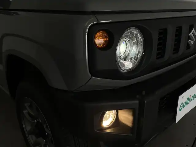 スズキ ジムニー XC 群馬県 2024(令6)年 0.1万km未満 ミディアムグレー 届出済未使用車(登録時走行距離:8km)/社外７インチナビ/シートヒーター/スズキセーフティサポート/・デュアルセンサーブレーキサポート/・車線逸脱警報機能/・ふらつき警報機能/・先行車発進お知らせ機能/・ハイビームアシスト/・標識認識/・クルーズコントロール/・LEDヘッドランプ