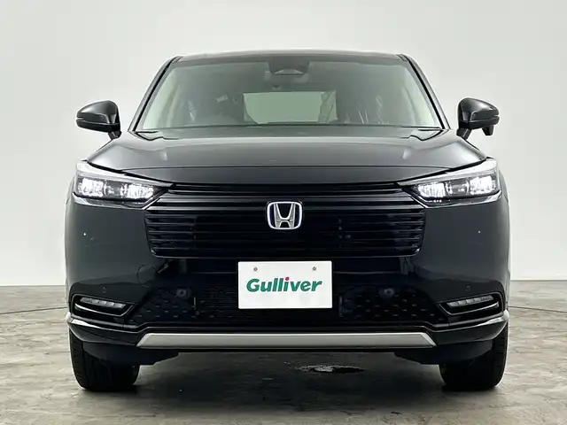 ホンダ ヴェゼル ハイブリッド e:HEV Z 三重県 2025(令7)年 0.1千km クリスタルブラックパール 登録済未使用車/純正ナビ/・AM/FM/Bluetooth/フルセグ/AndroidAuto/AppleCarPray/USB/ホンダセンシング/・ブラインドスポットインフォメーション/・車線逸脱/・衝突軽減ブレーキ/・アダプティブクルーズコントロール/前席シートヒーター/ステアリングヒーター/パワーバックドア/パドルシフト/ワイヤレスチャージャー/ETC2.0/LEDヘッドライト/ヒルディセントコントロール/電動パーキング/ハーフレザーシート/純正18インチAW
