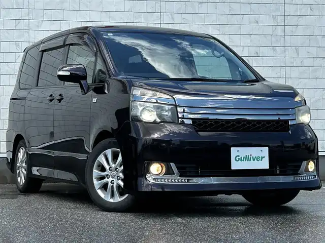 トヨタ ヴォクシー ZS G’s 富山県 2011(平23)年 7万km ボルドーマイカメタリック 純正ナビ/Bluetooth、ワンセグTV、AUX /ABS/盗難防止装置/オートライト/衝突軽減システム/プッシュスタート/スマートキー/パワーステアリング/パワーウィンドウ/ドライブレコーダー/ETC/両側パワースライドドア