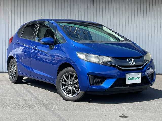 ホンダ フィット 13G Fパッケージ 長野県 2014(平26)年 10.5万km プラチナホワイトパール ４WD/純正メモリナビフルセグTV/CD/DVD/Bluetooth/USB/バックカメラ/ETC/社外15インチアルミ/アイドリングストップ/プッシュスタートエンジン/純正フロアマット/横滑り防止装置/取説