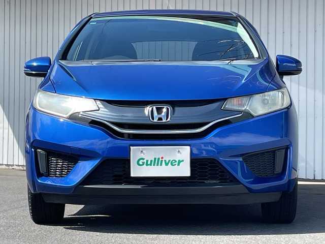 ホンダ フィット 13G Fパッケージ 長野県 2014(平26)年 10.5万km プラチナホワイトパール ４WD/純正メモリナビフルセグTV/CD/DVD/Bluetooth/USB/バックカメラ/ETC/社外15インチアルミ/アイドリングストップ/プッシュスタートエンジン/純正フロアマット/横滑り防止装置/取説