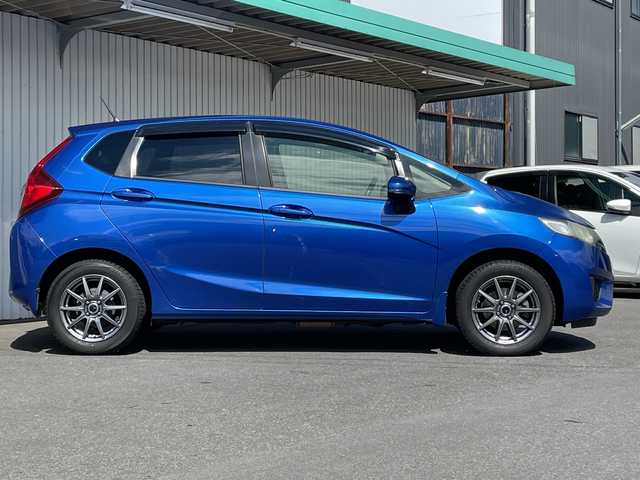 ホンダ フィット 13G Fパッケージ 長野県 2014(平26)年 10.5万km プラチナホワイトパール ４WD/純正メモリナビフルセグTV/CD/DVD/Bluetooth/USB/バックカメラ/ETC/社外15インチアルミ/アイドリングストップ/プッシュスタートエンジン/純正フロアマット/横滑り防止装置/取説