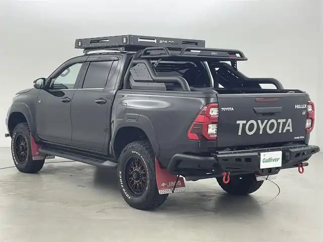 トヨタ ハイラックス Z GRスポーツ 福岡県 2024(令6)年 1.8万km アティチュードブラックマイカ ルーフキャリア　/スポーツバー　/サイドマフラー　/フロントバンパーガード　/ボンネットライト　/ＪＡＯＳマッドガード　/ベッドライナー　/トノカバー　/リフトアップ　/ホワイトレタータイヤ　/純正８型ナビ　/全方位カメラ　/ＥＴＣ　/前後ドラレコ　/デジタルインナーミラー　/レーダー探知機　/レーダークルーズコントロール　/コーナーセンサー　/衝突軽減ブレーキ　/レーンキープ　/ヒルディセントコントロール　/横滑り防止装置　/アイドリングストップ　/パワーヒーター　/排出ガス浄化装置（ＤＰＦ）　/リヤデフロック（４ＷＤ）　/ハーフレザーシート　/パワーシート　/社外１８インチＡＷ　/ＬＥＤ灯
