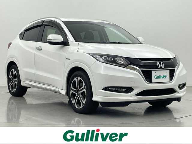 ホンダ ヴェゼル ハイブリッド Z ホンダセンシング 熊本県 2016(平28)年 5.7万km ホワイトオーキッドパール 禁煙車　/純正ナビVXM-174VFXi（ＣＤ・ＤＶＤ・フルセグ・ＢＴ・ＵＳＢ）/バックカメラ　/前方ドライブレコーダー　/ビルトインETC/前席シートヒーター　/ホンダセンシング/・衝突軽減ブレーキ/・レーンキープアシスト/・誤発進抑制機能/・車線維持支援機能/・歩行者事故低減ステアリング/・路外逸脱抑制機能/・先行車発進お知らせ/・標識認識機能/横滑り防止/ハーフレザーシート/純正フロアマット/純正１７インチＡＷ/オートライト/LEDヘッドライト/フォグライト/スマートキー/プッシュスタート