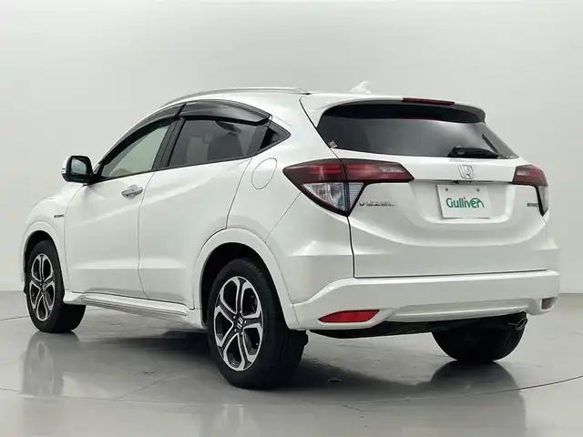 ホンダ ヴェゼル ハイブリッド Z ホンダセンシング 熊本県 2016(平28)年 5.7万km ホワイトオーキッドパール 禁煙車　/純正ナビVXM-174VFXi（ＣＤ・ＤＶＤ・フルセグ・ＢＴ・ＵＳＢ）/バックカメラ　/前方ドライブレコーダー　/ビルトインETC/前席シートヒーター　/ホンダセンシング/・衝突軽減ブレーキ/・レーンキープアシスト/・誤発進抑制機能/・車線維持支援機能/・歩行者事故低減ステアリング/・路外逸脱抑制機能/・先行車発進お知らせ/・標識認識機能/横滑り防止/ハーフレザーシート/純正フロアマット/純正１７インチＡＷ/オートライト/LEDヘッドライト/フォグライト/スマートキー/プッシュスタート