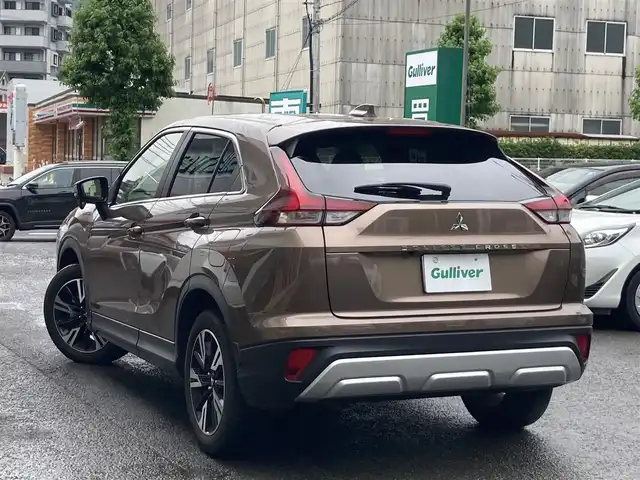 三菱 エクリプス クロス G 長崎県 2023(令5)年 2万km ブロンズメタリック 登録時19534km/社外ナビ/TV/Bluetooth/AM.FM/バックカメラ/ETC/D＋N席シートヒーター/ステアリングヒーター/ドライブレコーダー/パドルシフト/レーダークルーズコントロール/パワーバックドア