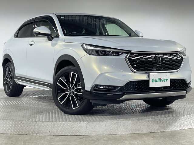 ホンダ ヴェゼル ハイブリッド e:HEV Z 神奈川県 2021(令3)年 4.4万km プレミアムホワイトパール ホンダセンシング(安全運転支援システム)/ホンダコネクト９型ディスプレイ/ワイヤレス充電/マルチビューカメラシステム/フルセグTV/ＥＴＣ/ＬＫＡ/ハーフレザー/ハンドル＆シートヒーター/純正１８ＡＷ/ハンズフリーアクセスパワーテールゲート（予約クローズ機能付）/LEDシーケンシャルターンシグナルランプ（フロント）/クリアブラック塗装バンパーガーニッシュ（フロント/サイド/リア）/LEDフォグライト/ヒルディセントコントロール