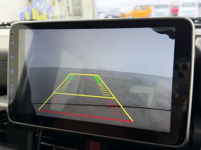 スズキ ジムニー ノマド FC 愛知県 2025(令7)年 0.1万km ブルーイッシュブラックパール3 10インチディスプレイオーディオ/ヒッチメンバー/ルーフキャリア/茶レザーシートカバー/背面タイヤ/ETC/４ＷＤ/デュアルブレーキサポート/レーダークルーズコントロール/シートヒーター（D+N)/ミラーヒーター/パーキングソナー/オートライト/社外16インチＡＷ/革巻きステアリング/ダウンヒルアシストコントロール/LEDヘッドライト/スマートキー/プッシュスタート/横滑り防止装置